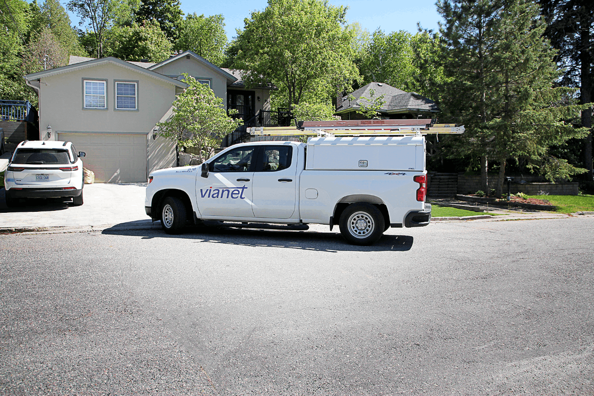 ViaNet service van parked in a residential driveway for on-site installation